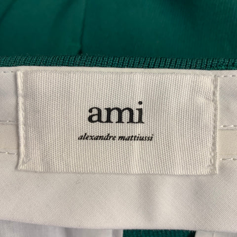Costume AMI by ALEXANDRE MATTIUSSI en laine verte à revers crantés, taille 38