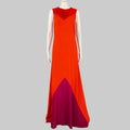 Mannequin wearing a red and purple evening gown against a gray background