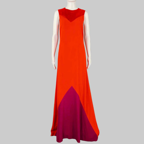 Mannequin wearing a red and purple evening gown against a gray background
