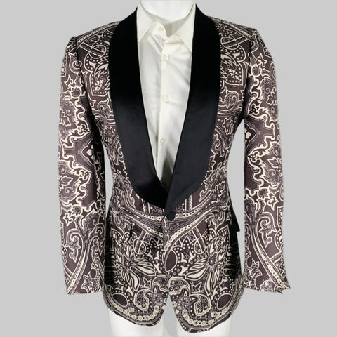 A black and grey GUCCI sport coat with a graphic pattern, shawl lapel, and single button closure.