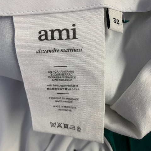 Costume AMI by ALEXANDRE MATTIUSSI en laine verte à revers crantés, taille 38
