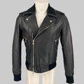 Black leather jacket on a mannequin against a gray background