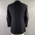 Back view of the black sport coat showing the center back seam and long hem.