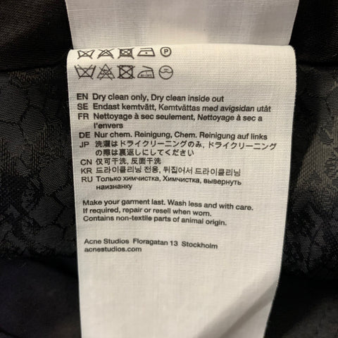 Pantalon large en laine à motif pied-de-poule crème et noir ACNE taille 31