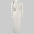 White dress with embellishments on a mannequin against a gray background