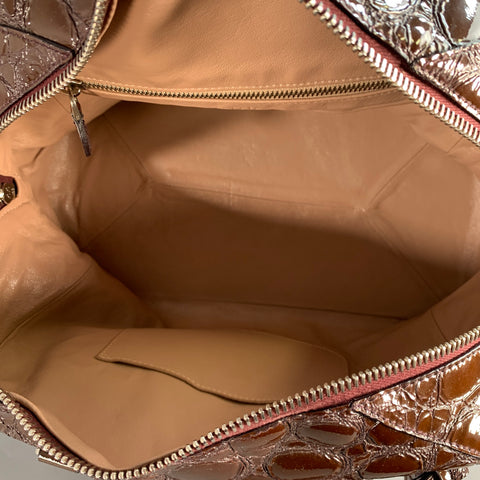 Sac à main ALAIA en cuir verni embossé marron avec anses et bandoulière