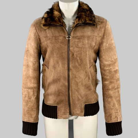 Brown distressed deerskin leather shearling zip-up jacket with a fur-lined collar, black knit cuffs, and a zip front closure.