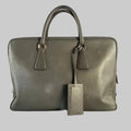 Gray handbag with matching pouch on a light gray background