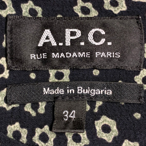 Robe A.P.C. taille 2 noire et blanche à motifs floraux, à manches longues, ceinturée, longueur genou