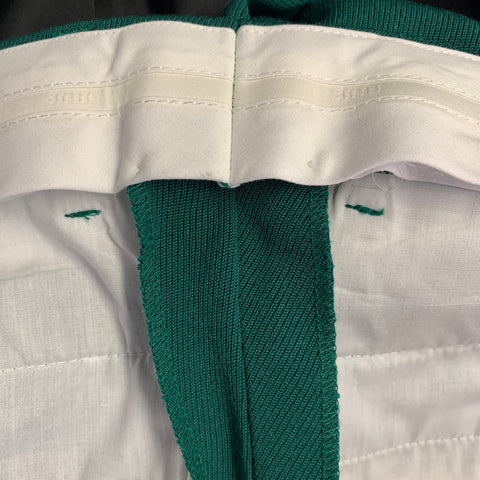 Costume AMI by ALEXANDRE MATTIUSSI en laine verte à revers crantés, taille 38