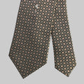 Patterned tie on a light beige background