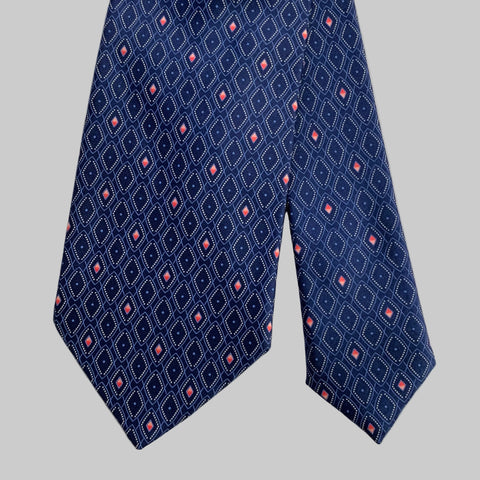 Navy blue tie with pink geometric pattern on a light gray background