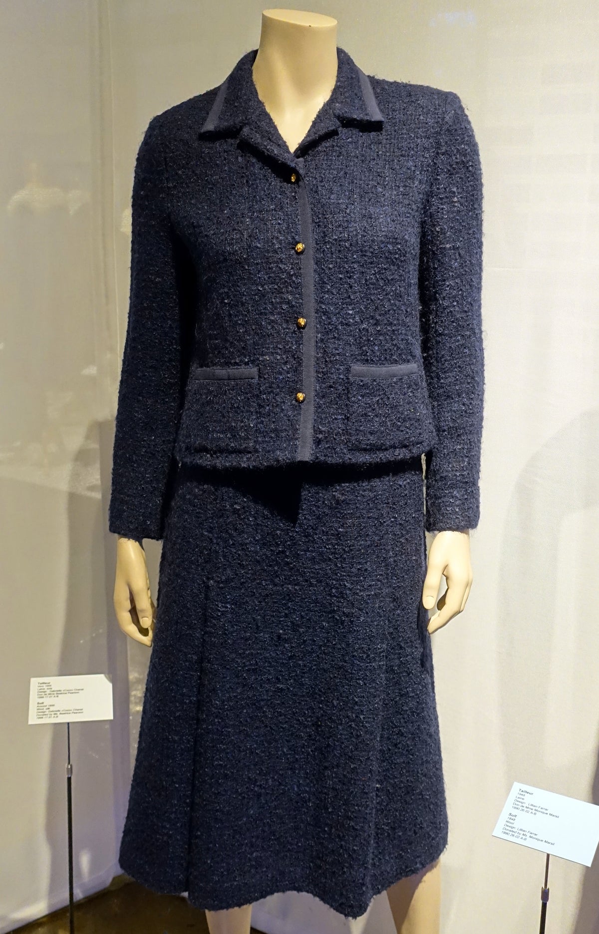 Circa 1955 navy Chanel wool and silk suit displayed at the Musée de la mode in Montreal