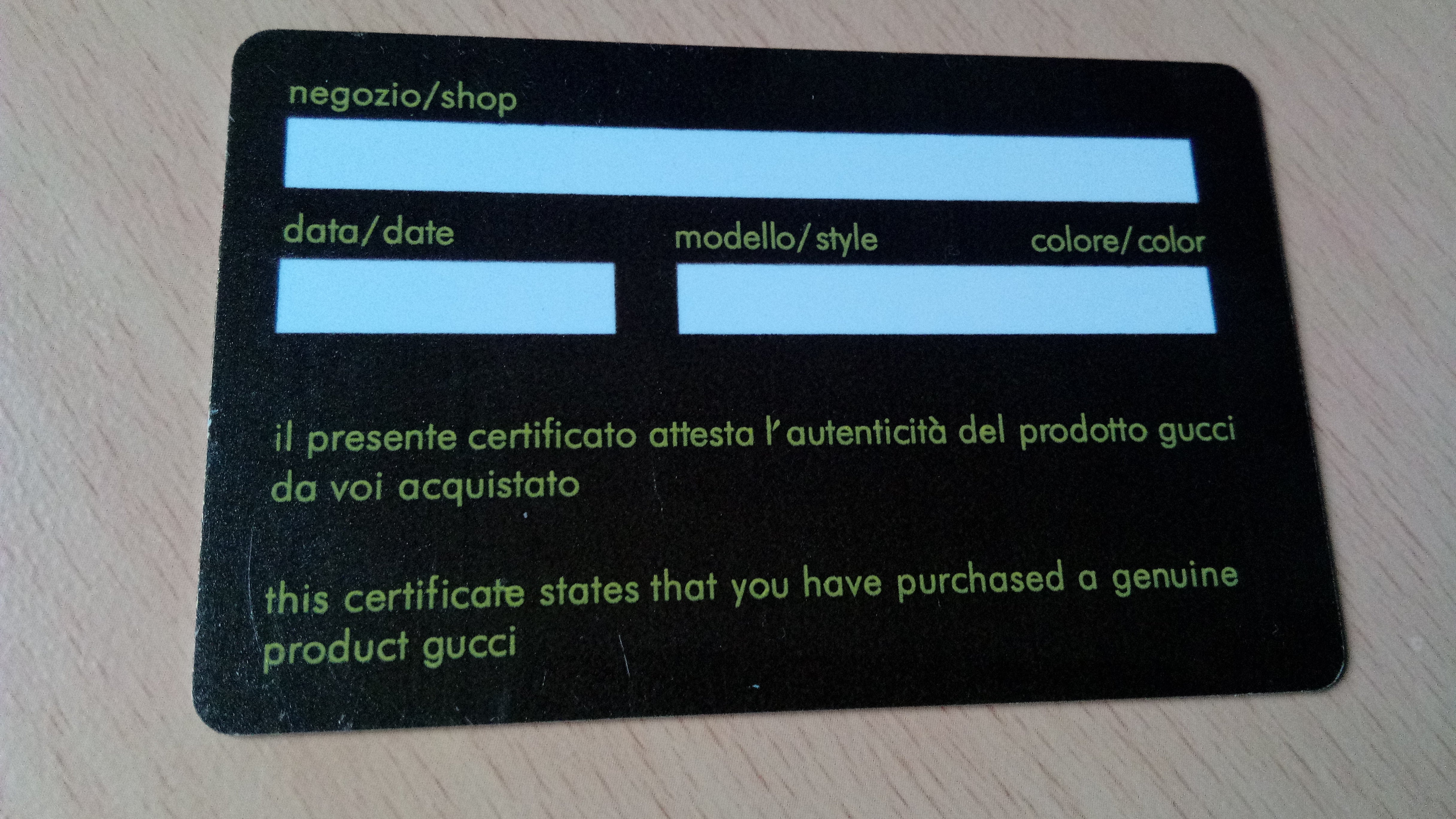 Detached Gucci authenticity card photographed in 2019