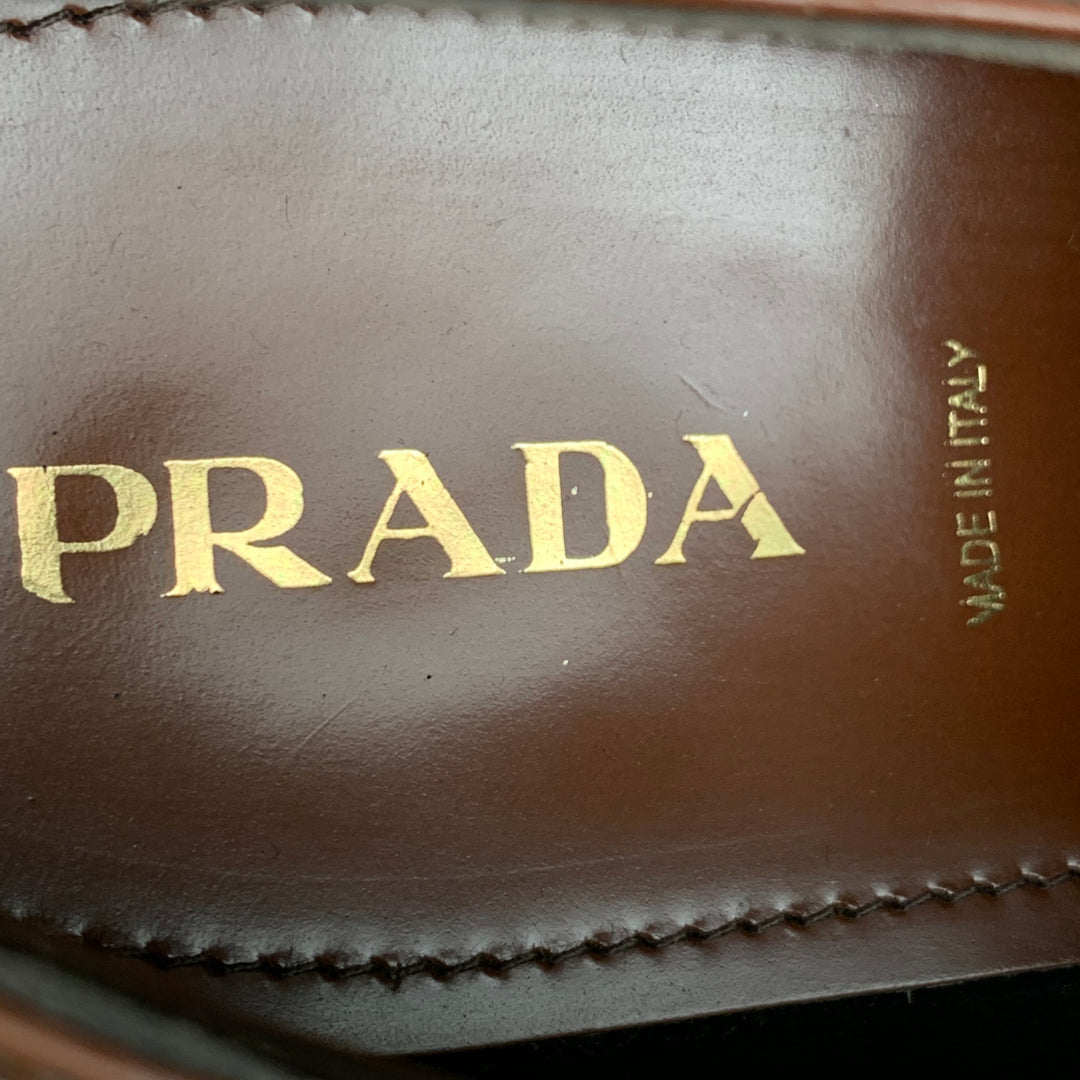 PRADA Talla 10.5 Cordones de punta de ala perforados de cuero naranja tostado