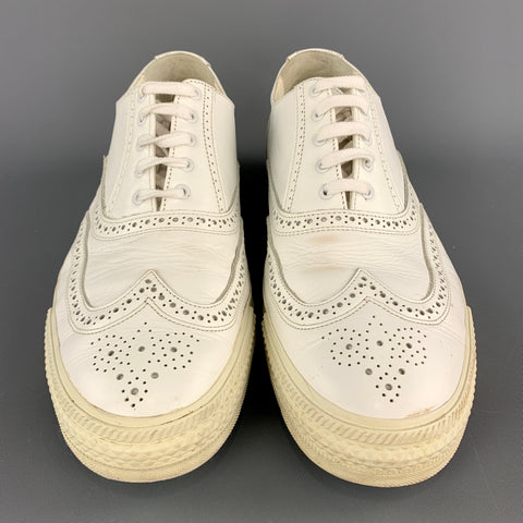 COMME des GARCONS HOMME PLUS Baskets à bout d'aile en cuir blanc perforé taille 10