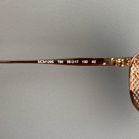 Lunettes de soleil en métal rose doré MCM