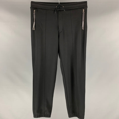 GIVENCHY Talla L Pantalones deportivos de algodón y poliéster lisos negros Pantalones casuales