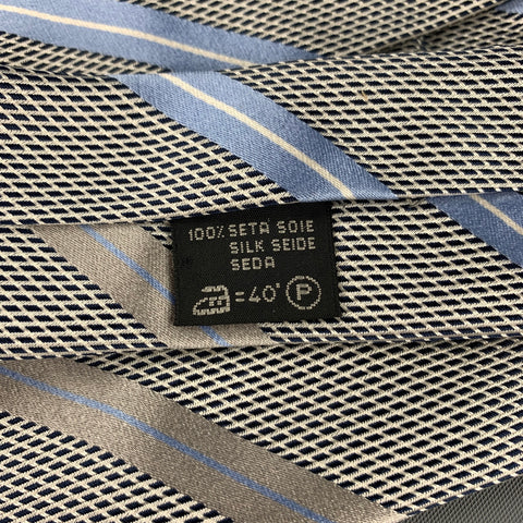 ERMENEGILDO ZEGNA Corbata de seda con rayas diagonales gris y azul claro
