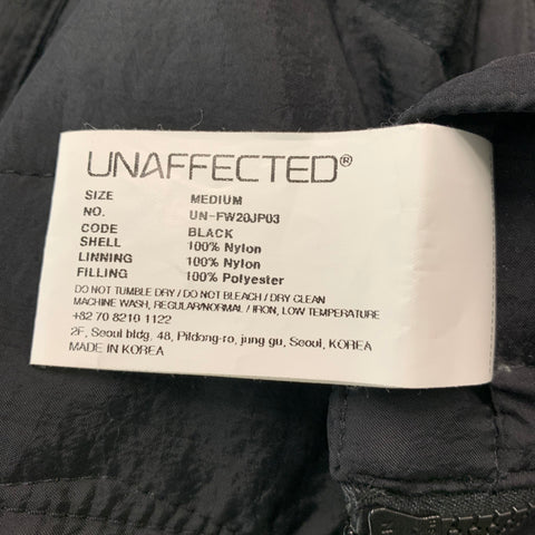 UNAFFECTED Taille M Veste pull en nylon noir