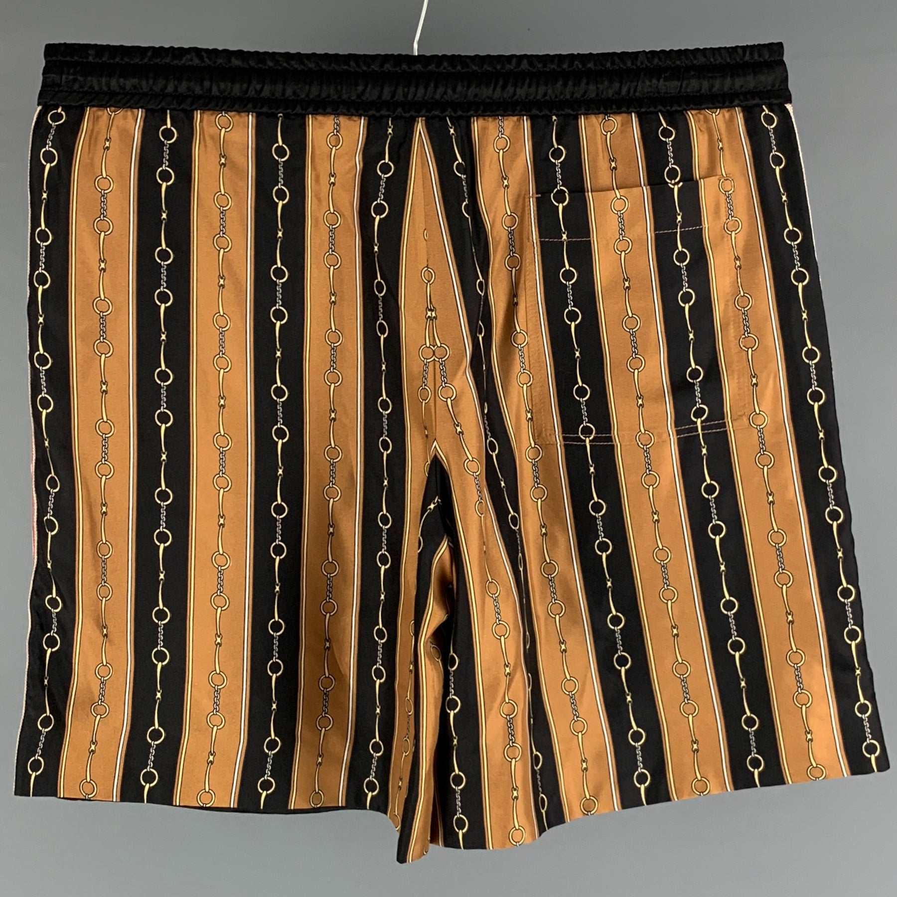 gold gucci shorts