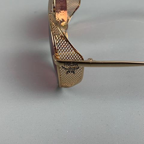 Lunettes de soleil en métal rose doré MCM