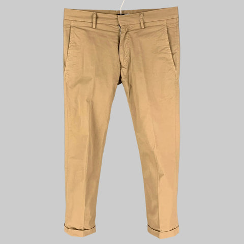 Beige khaki cotton blend narrow leg casual pants hung on a hanger.
