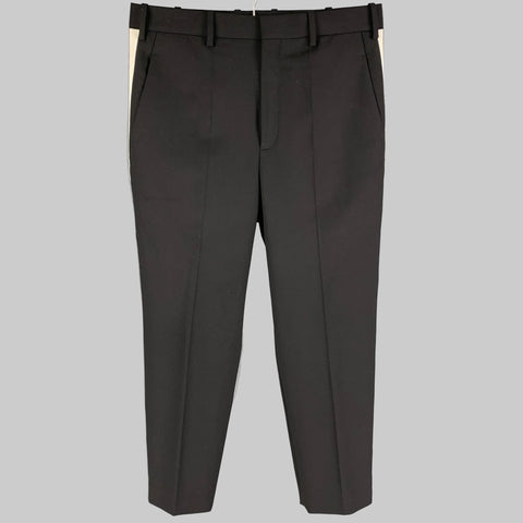 NEIL BARRETT black and white dress pants with a dropped crotch fit, featuring a vertical stripe pattern, made of polyester and wool, displayed on a plain background.