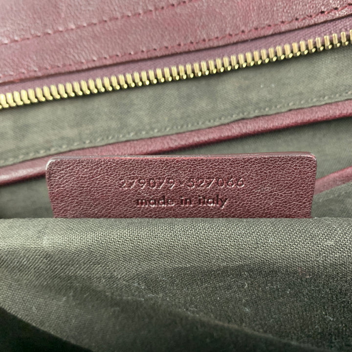 YVES SAINT LAURENT 2012 CABAS Bolso de cuero color burdeos con herrajes dorados