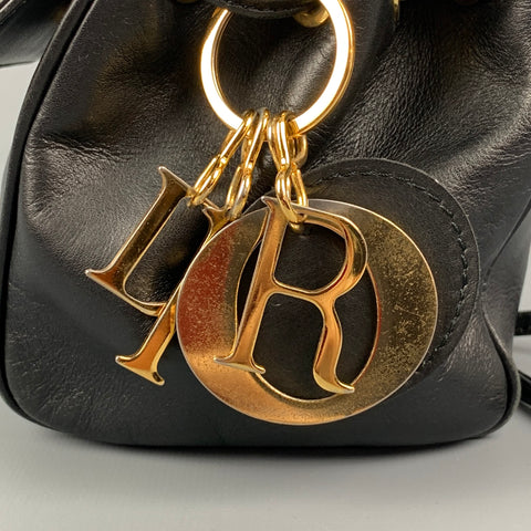 Vintage CHRISTIAN DIOR cuero negro oro encanto bolso de hombro mini bolso