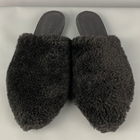 JENNI KAYNE Mules planos de piel de oveja negra talla 7