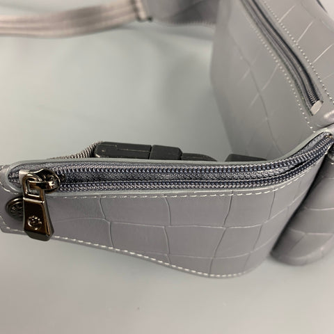 Riñonera LONGCHAMP de piel repujada gris