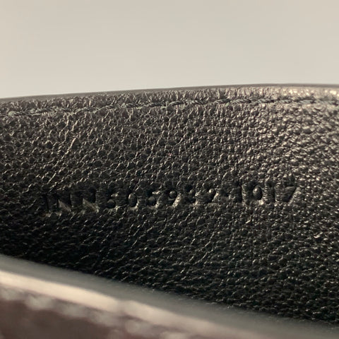 SAINT LAURENT Porte-cartes à clip en cuir embossé noir