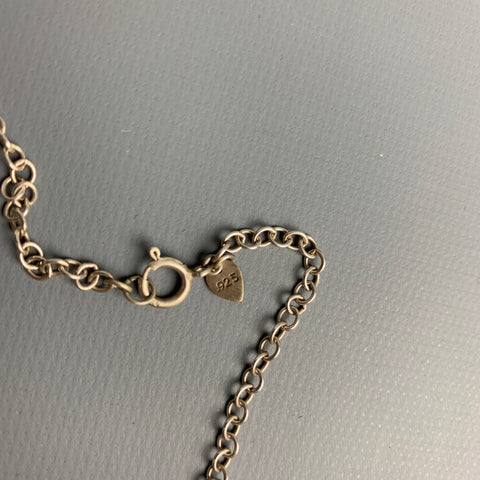 ME&RO Sterling Silver Engraved Tooth Necklace