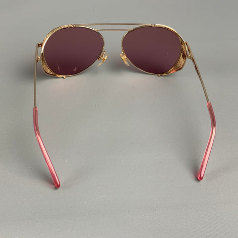 Lunettes de soleil en métal rose doré MCM
