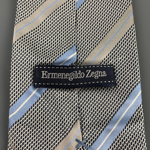 ERMENEGILDO ZEGNA Corbata de seda con rayas diagonales gris y azul claro