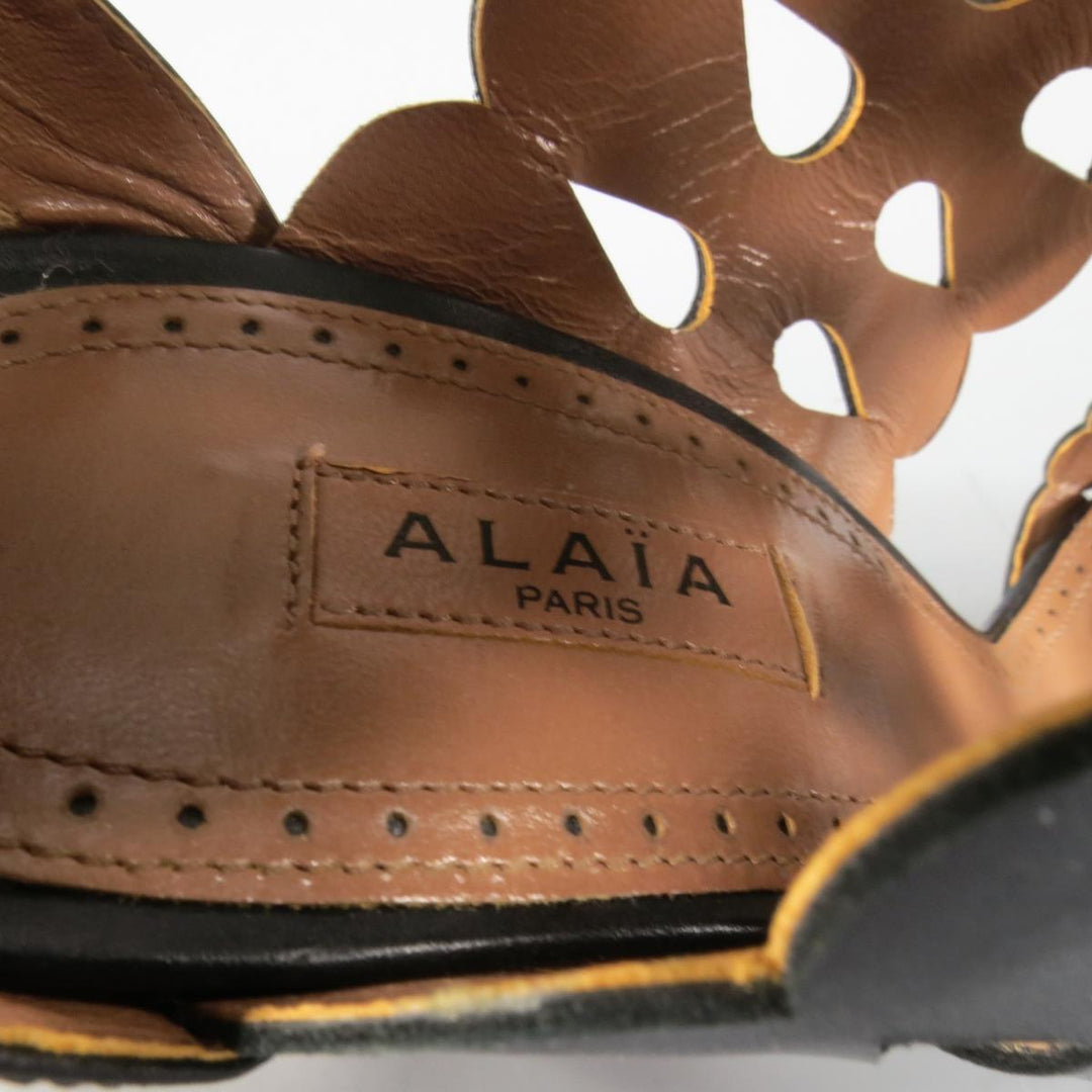ALAIA Size 8.5 Black Cutout Leather Fringe Ankle Sandals