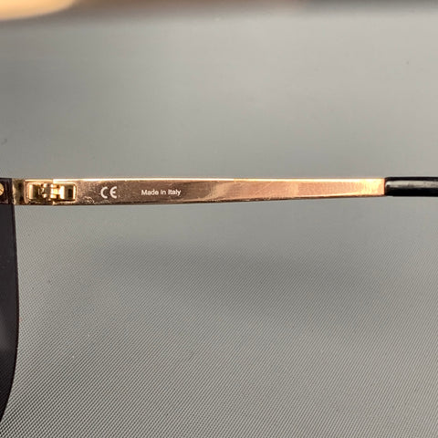 Lunettes de soleil ESCADA en métal noir doré