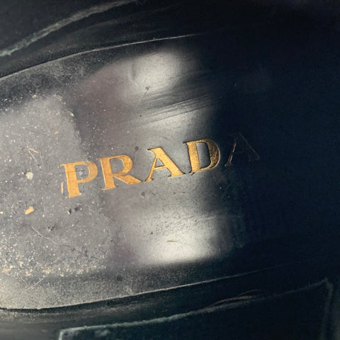 PRADA Bottines en cuir perforé noir taille 9