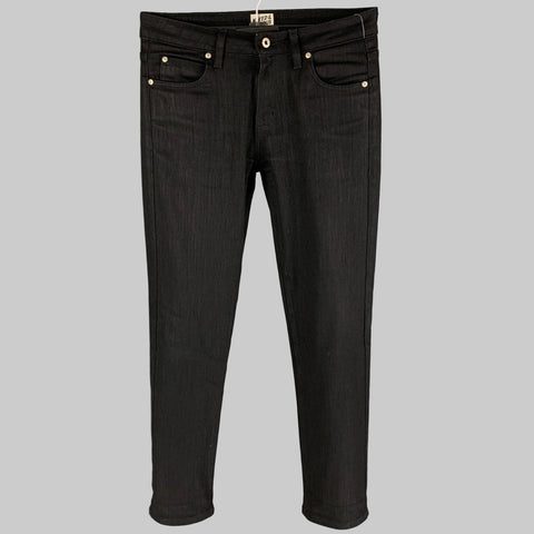 A pair of black cotton slim jeans with a zip fly closure and button details on the waist.