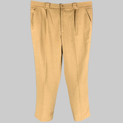 A pair of tan angora wool pleated dress pants by GIANNI VERSACE, displayed on a plain background.