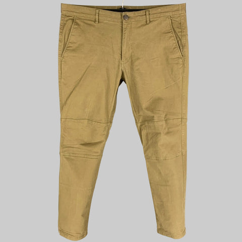 THEORY khaki casual pants made of cotton and polyurethane, displayed on a hanger, showing a straight leg and slim fit design with knee panels.