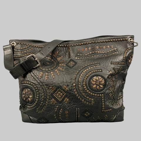 Decorative handbag with intricate patterns and embellishments on a gray background