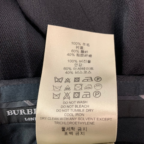 BURBERRY LONDON Taille 30 Pantalon habillé à pattes latérales en laine unie noire