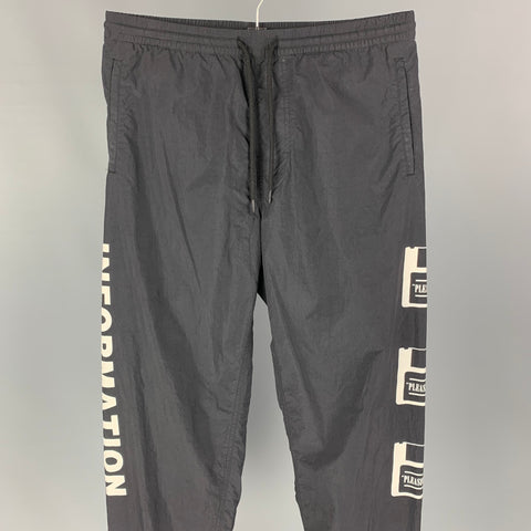 PLEASURES Information Surcharge Taille M Pantalon décontracté en nylon noir et blanc avec cordon de serrage
