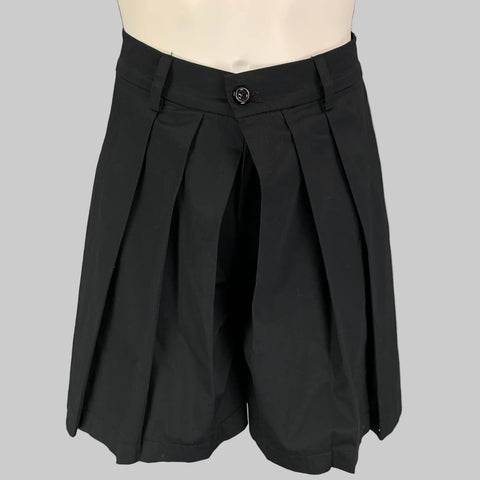Black pleated wide leg shorts displayed on a mannequin, featuring a high waist and a zip fly closure.
