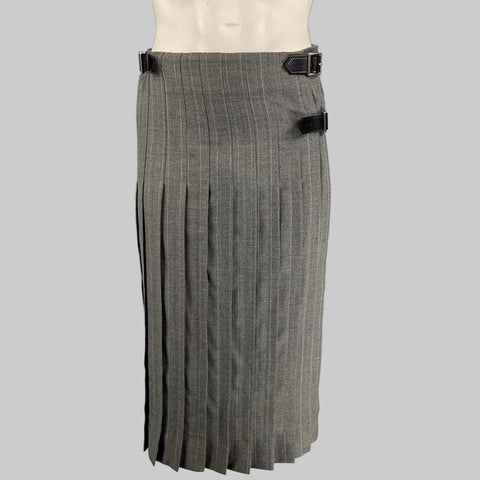 Gray pleated kilt on a mannequin against a gray background