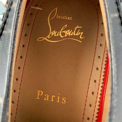 CHRISTIAN LOUBOUTIN Talla 8 Zapatos con cordones y punta de ala de cuero con tachuelas negros