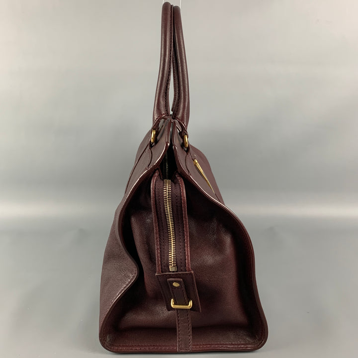 YVES SAINT LAURENT 2012 CABAS Bolso de cuero color burdeos con herrajes dorados