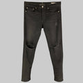 Black distressed slim button fly jeans with cotton and polyurethane fabric.